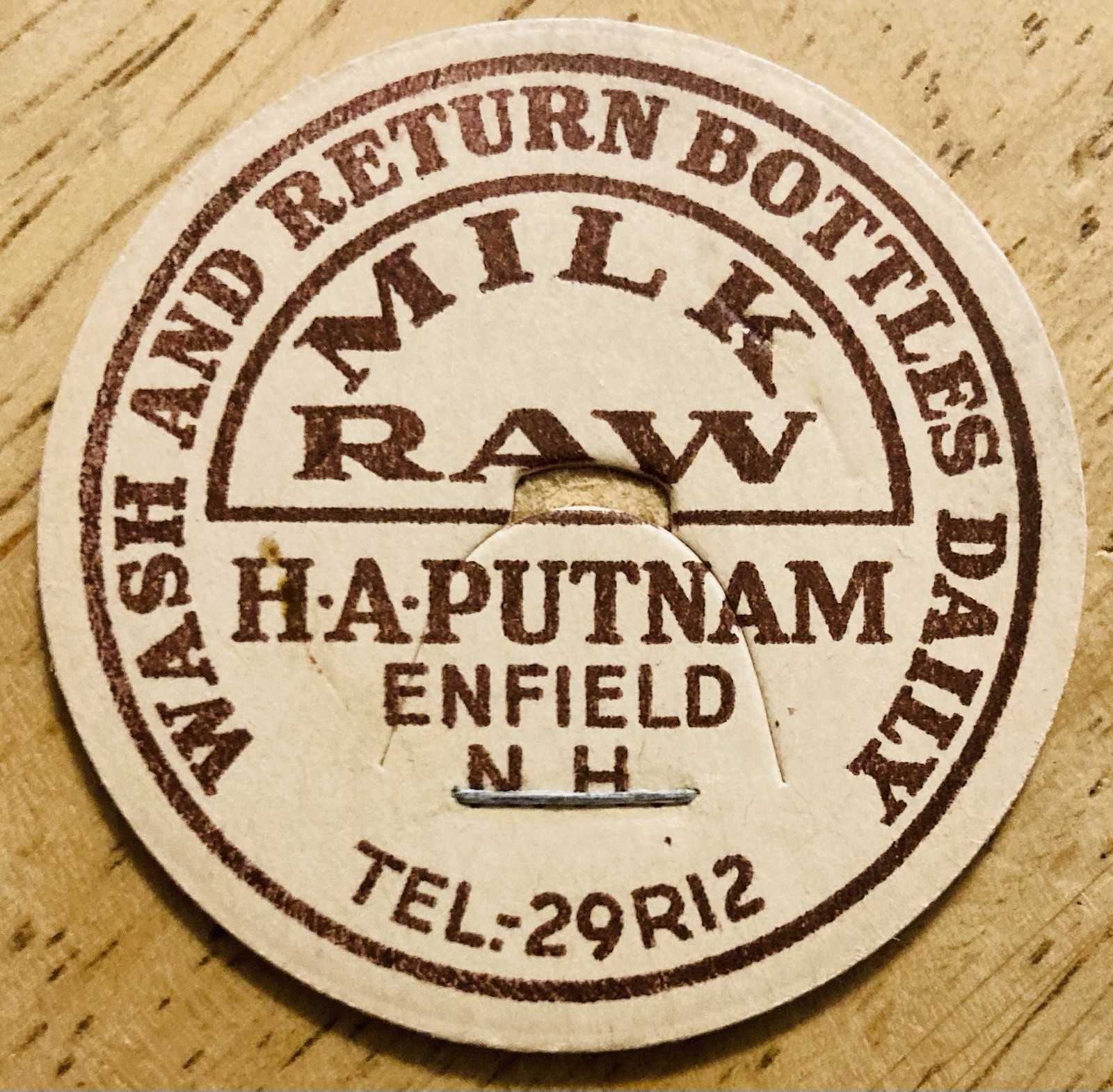 MILK BOTTLE CAP~H.A. PUTNAM DAIRY, ENFIELD, NH. RAW MILK