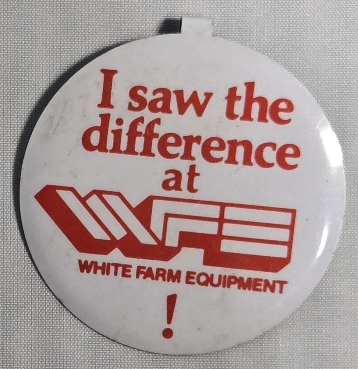 WHITE FARM EQUIPMENT 1983 PINBACK GOOD FOR 1 QUART OF WFE OIL