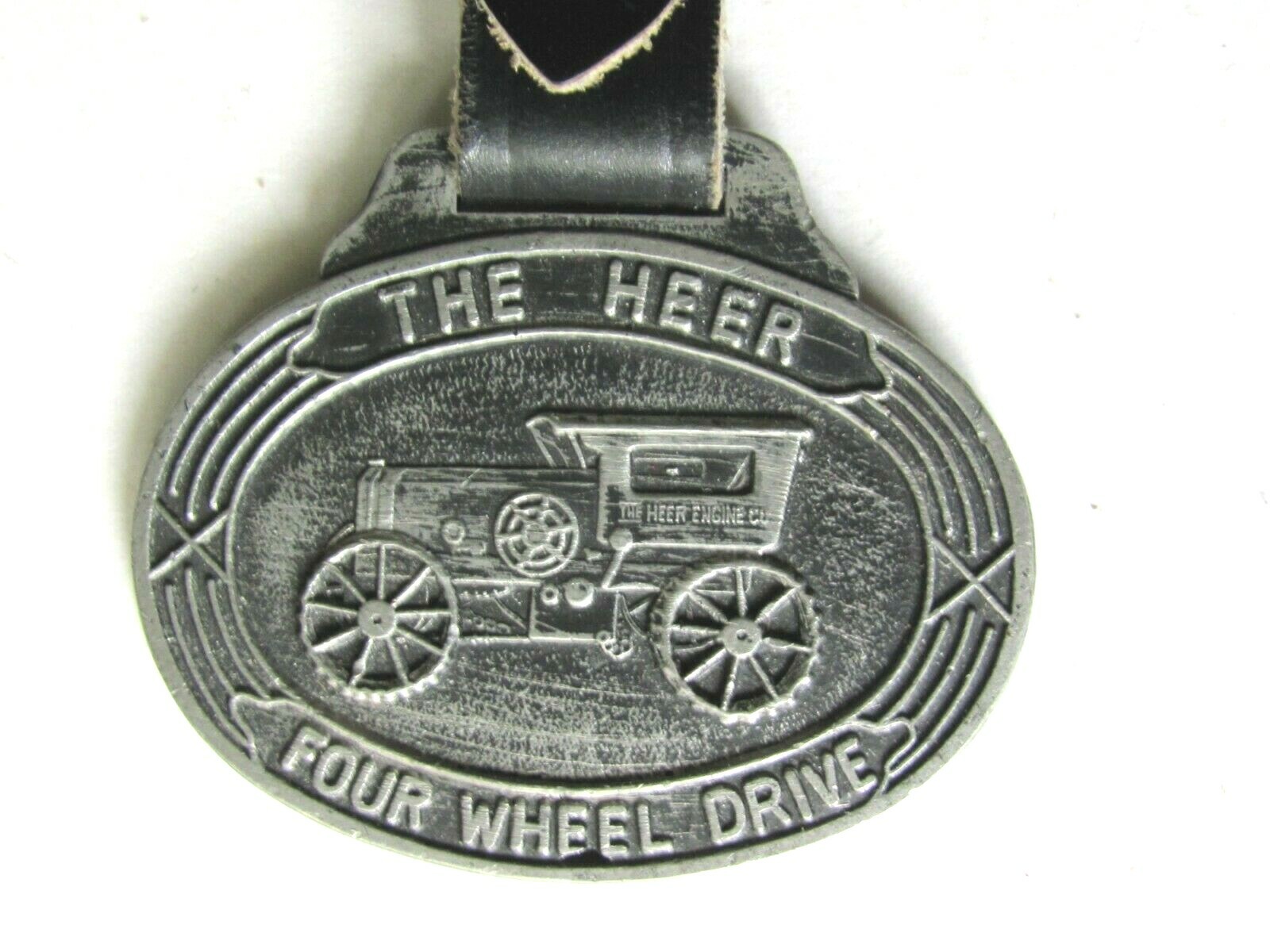 OLD WATCH FOB THE HEER FOUR WHEEL DRIVE TRACTOR HEER ENGINE CO PORTSMOUTH OHIO
