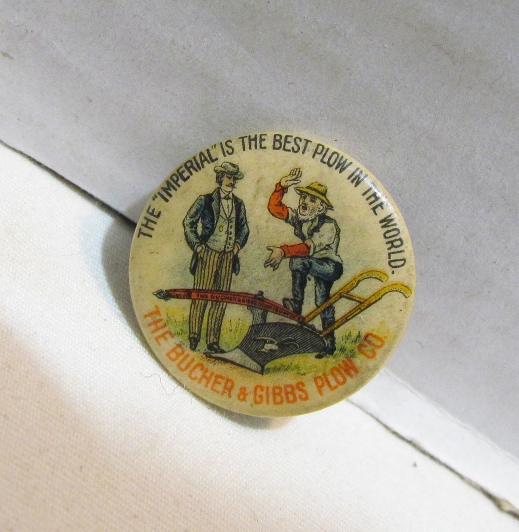 THE BUCHER & GIBBS PLOW CO. 1896 CELLULOID PINBACK BUTTON THE IMPERIAL IS BEST
