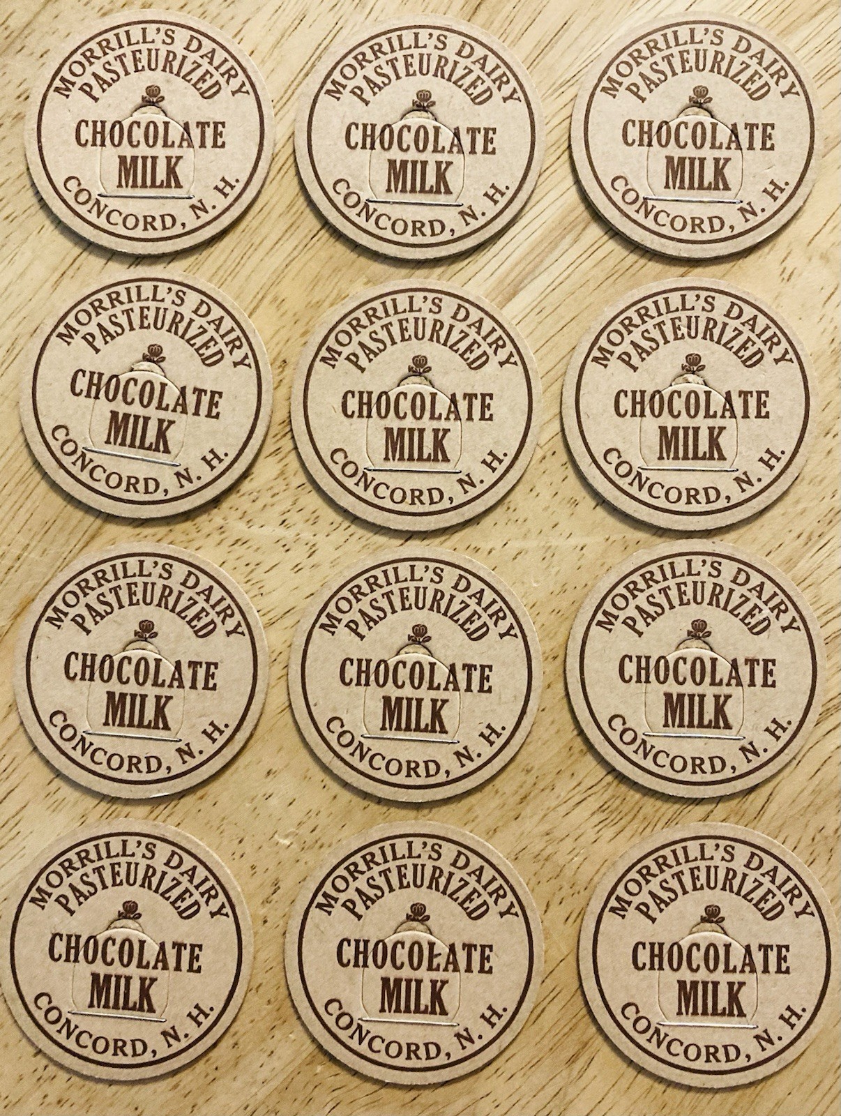 MILK BOTTLE CAP LOT OF (12)~MORRILL’S DAIRY FARM, CONCORD, NH. CHOCOLATE MILK
