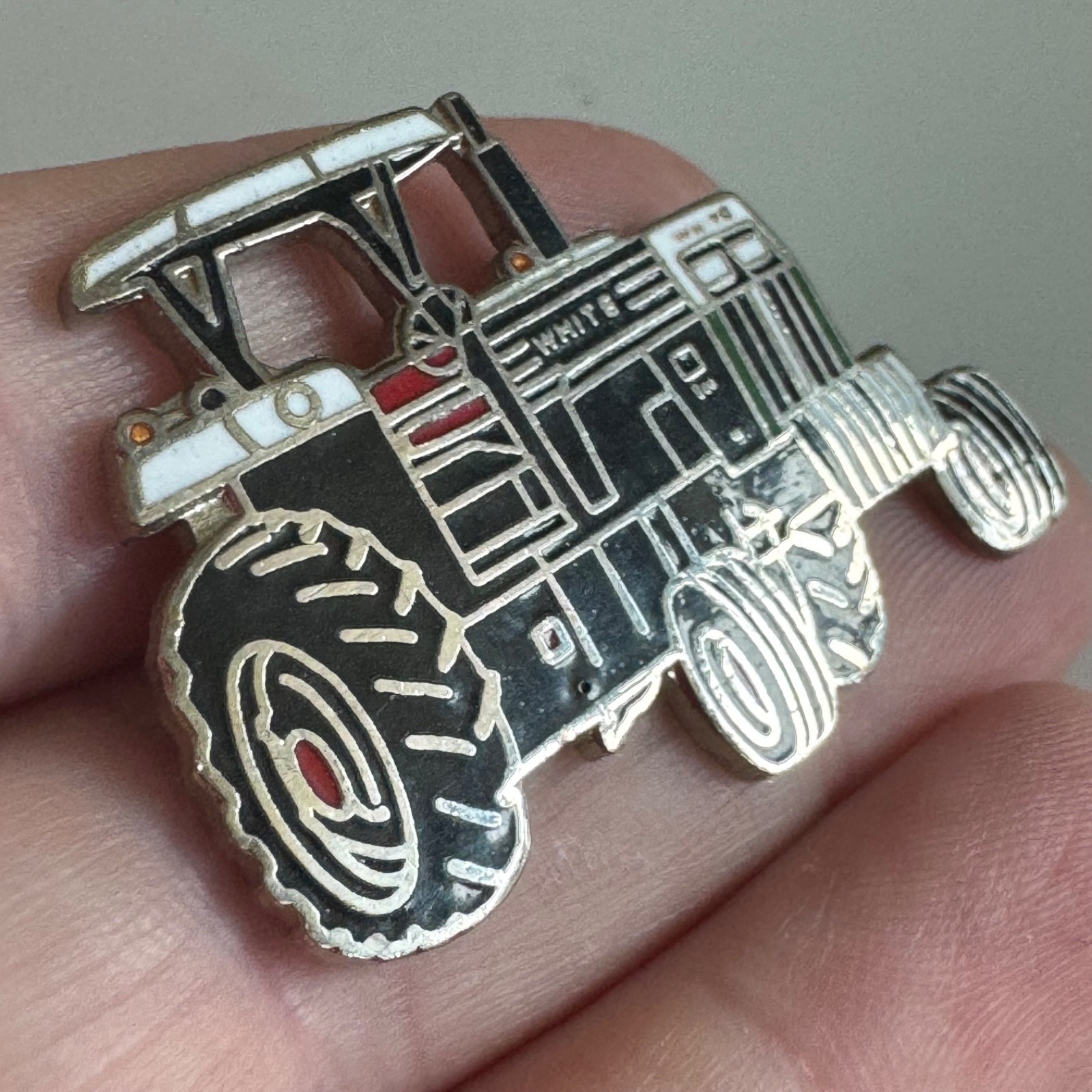 Vintage White Farm Equipment Tractor Enamel Lapel Pin Black White Red 2-60 ?