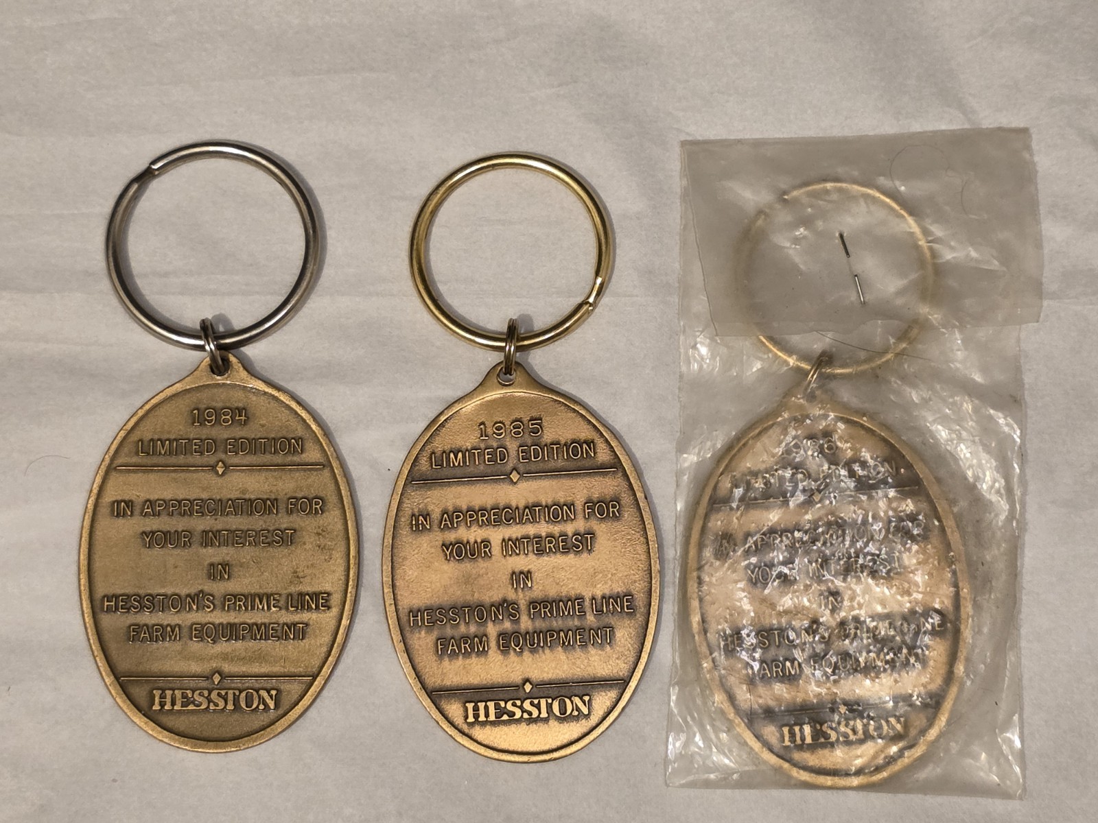 Hesston Prime Line 1984 1985 and 1986 Limited Edition Tractor Keychains