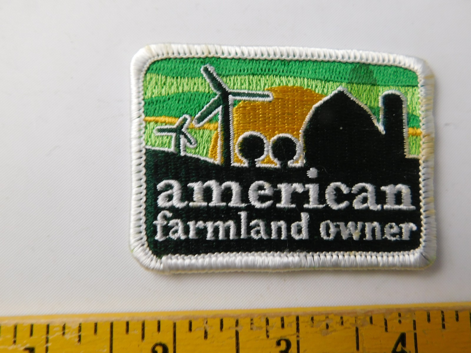 AMERICAN FARMLAND OWNER VINTAGE PATCH HAT BADGE FARM AGRICULTURE