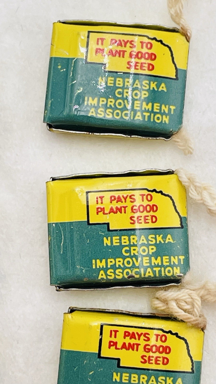 Lot 13 VTG Farm Metal Seed Bag Tag Clip NEBRASKA Crop Improvement Assoc & Idaho