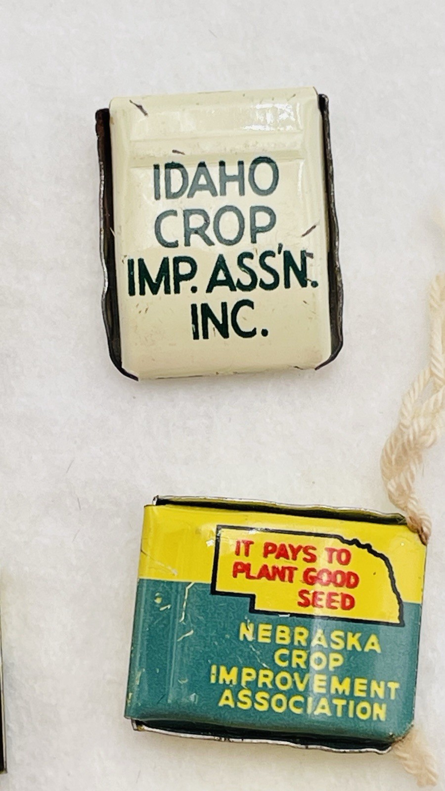 Lot 13 VTG Farm Metal Seed Bag Tag Clip NEBRASKA Crop Improvement Assoc & Idaho