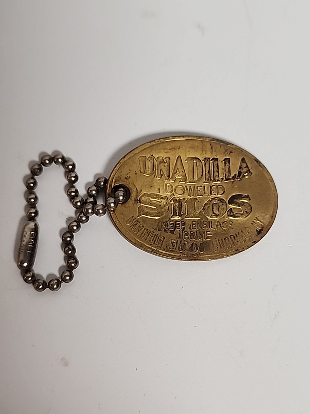 1906 ANTIQUE UNADILLA SILOS NY FARM ADVERTISING PENDANT KEYCHAIN CHARM FOB TAG