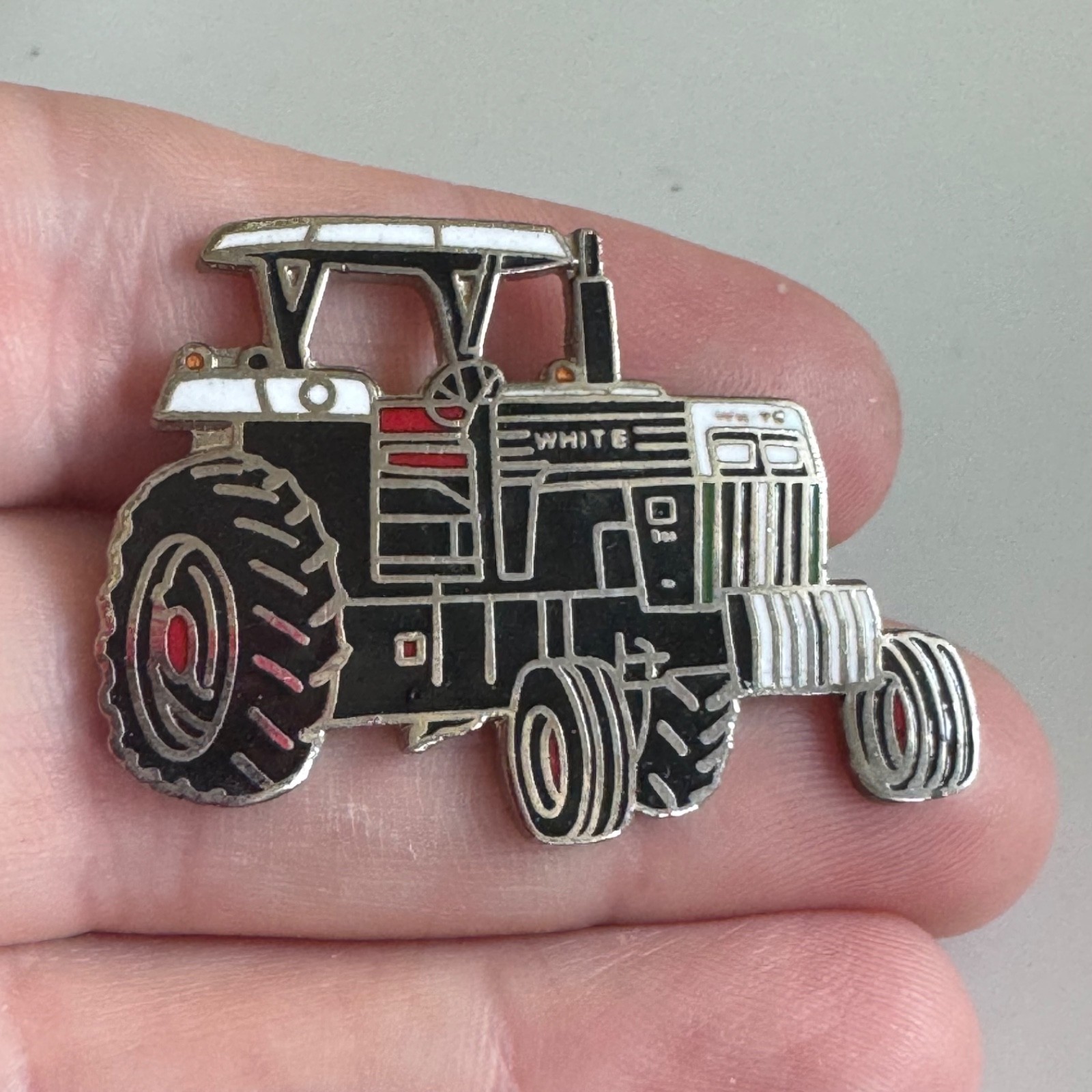 Vintage White Farm Equipment Tractor Enamel Lapel Pin Black White Red 2-60 ?