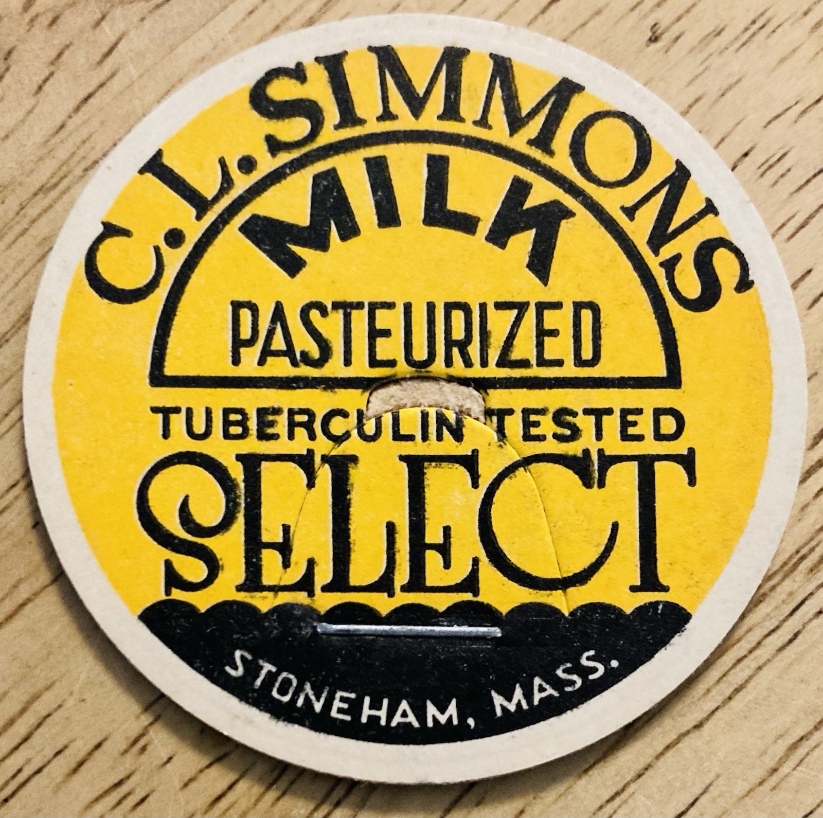 MILK BOTTLE CAP~C.L. SIMMONS DAIRY FARM, STONEHAM, MASS.