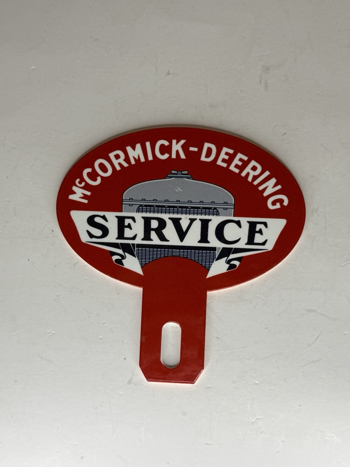 McCormick-Deering Service Advertising 4 1/4”x4 1/4” Qual License Plate Topper