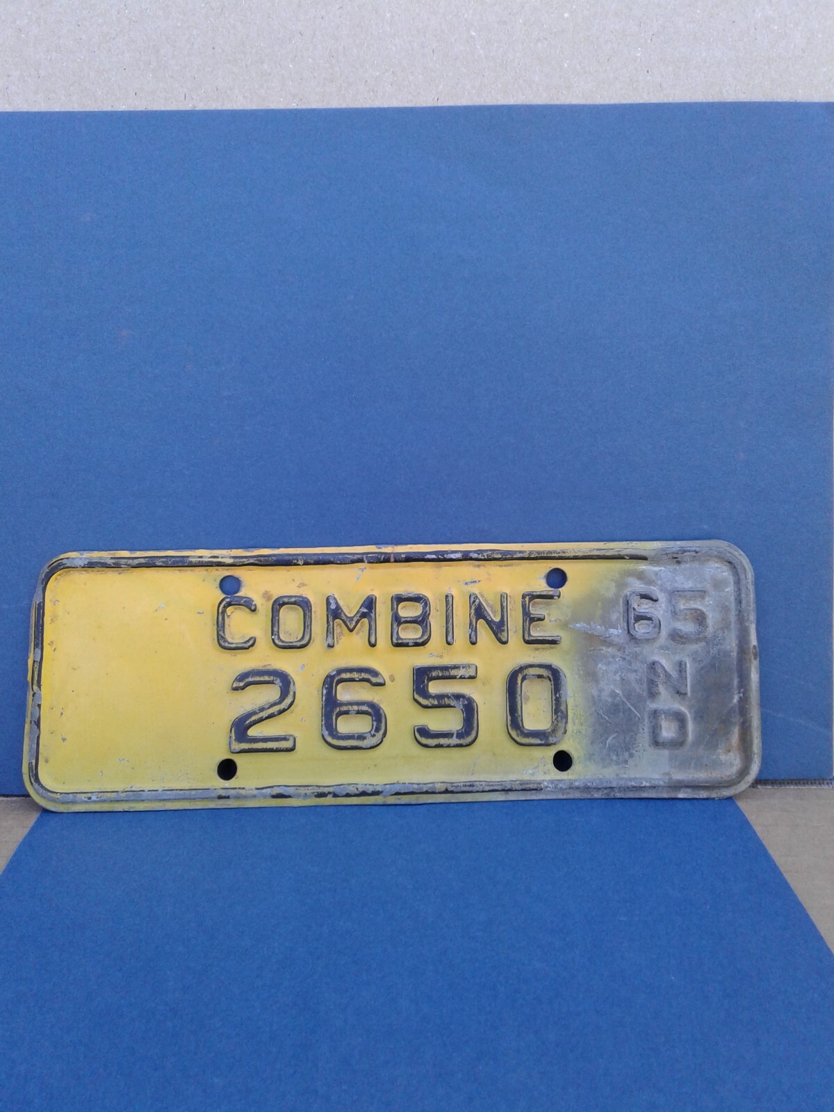 Collectible agriculture N.D. Combine 1965 tag.
