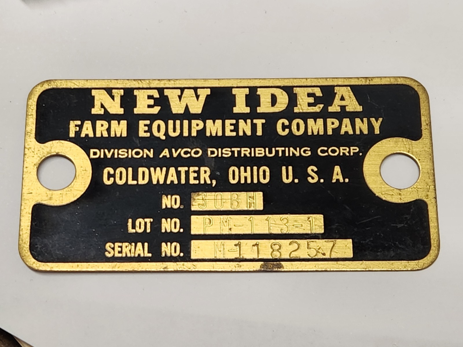 New Idea Farm Equipment Company Metal Brass Tag Emblem Coldwater Ohio