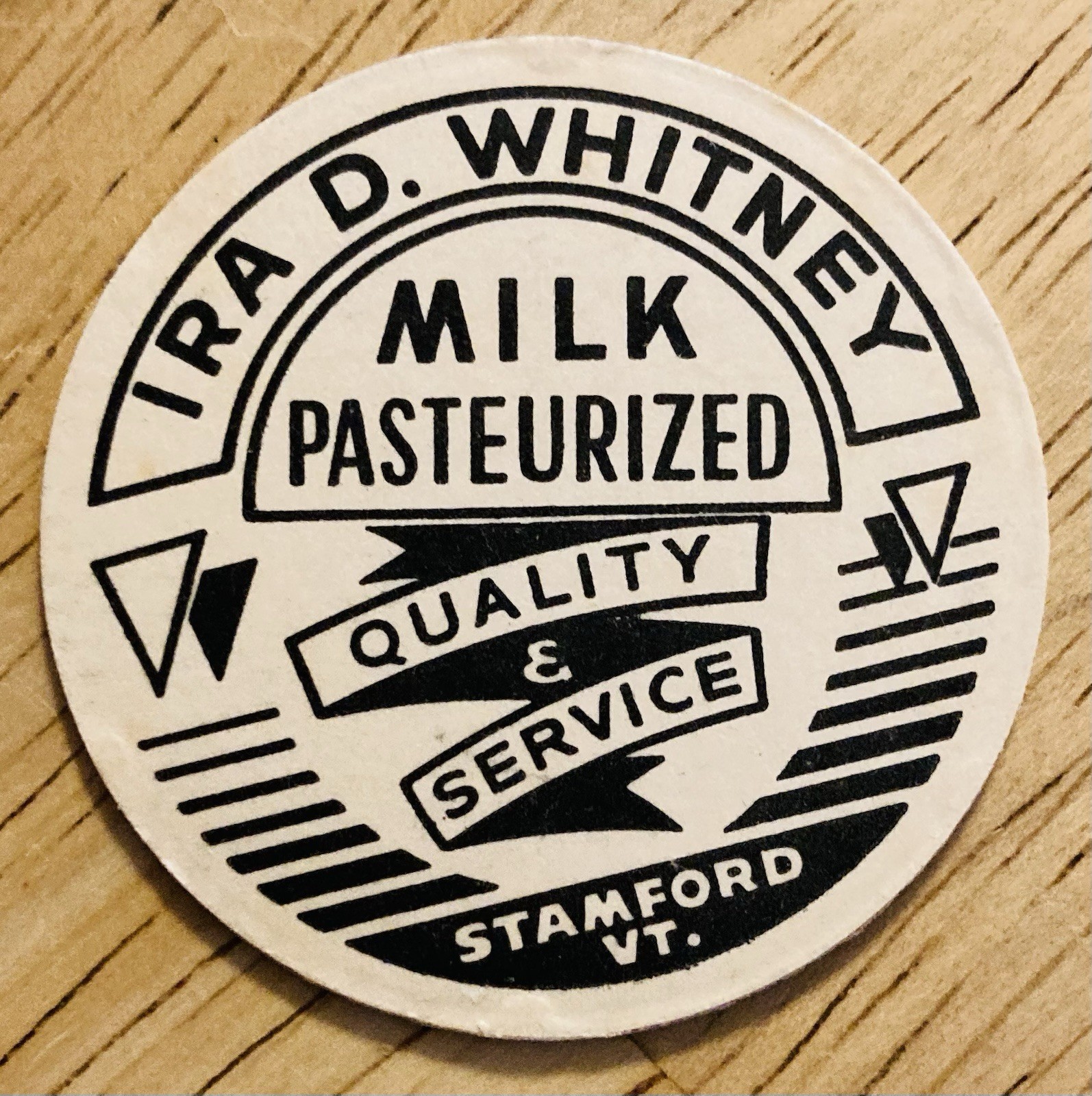 MILK BOTTLE CAP~IRA D. WHITNEY DAIRY, STAMFORD, VERMONT.