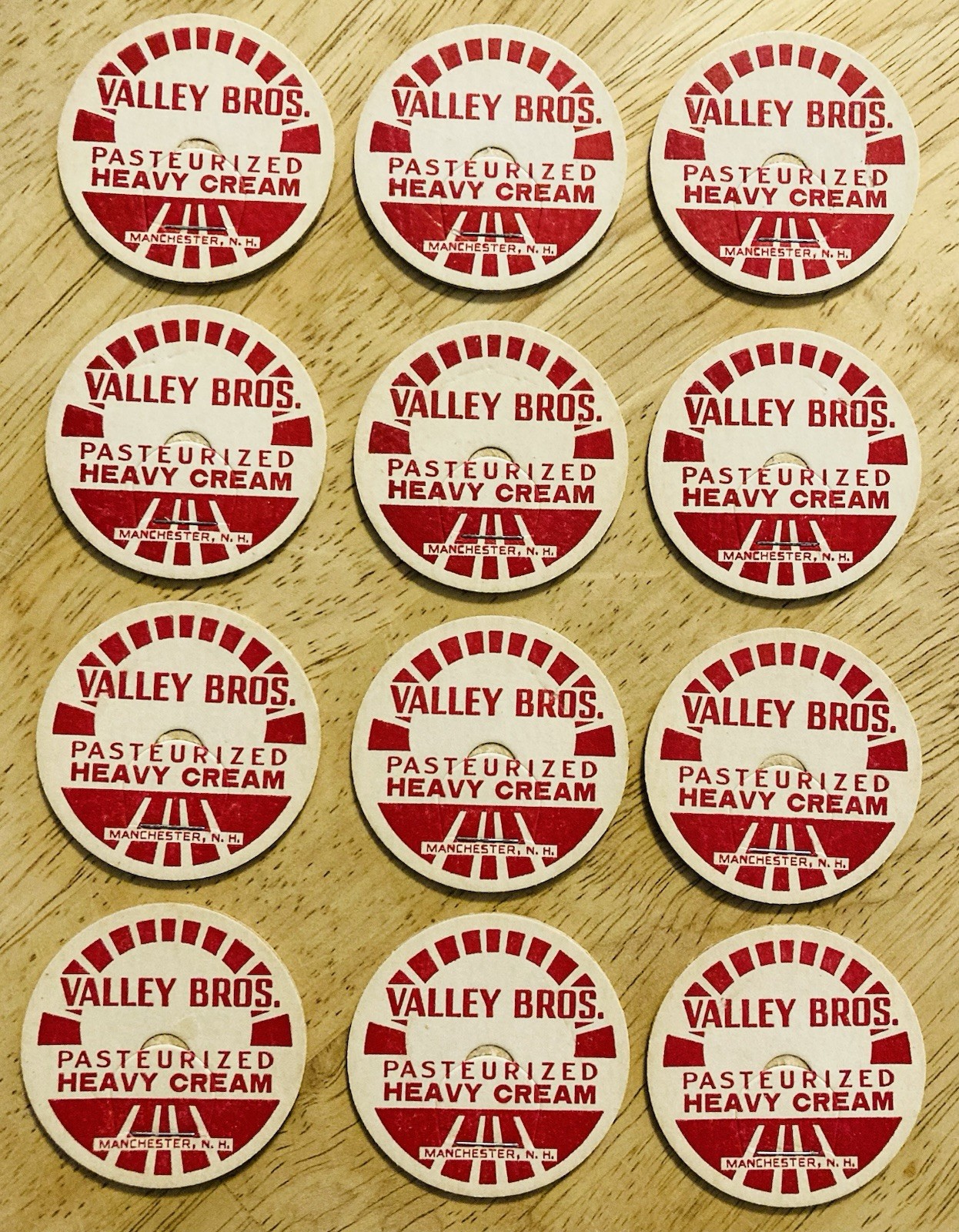 MILK BOTTLE CAP LOT OF (12)~VALLEY BROS. DAIRY FARM, MANCHESTER, NH.