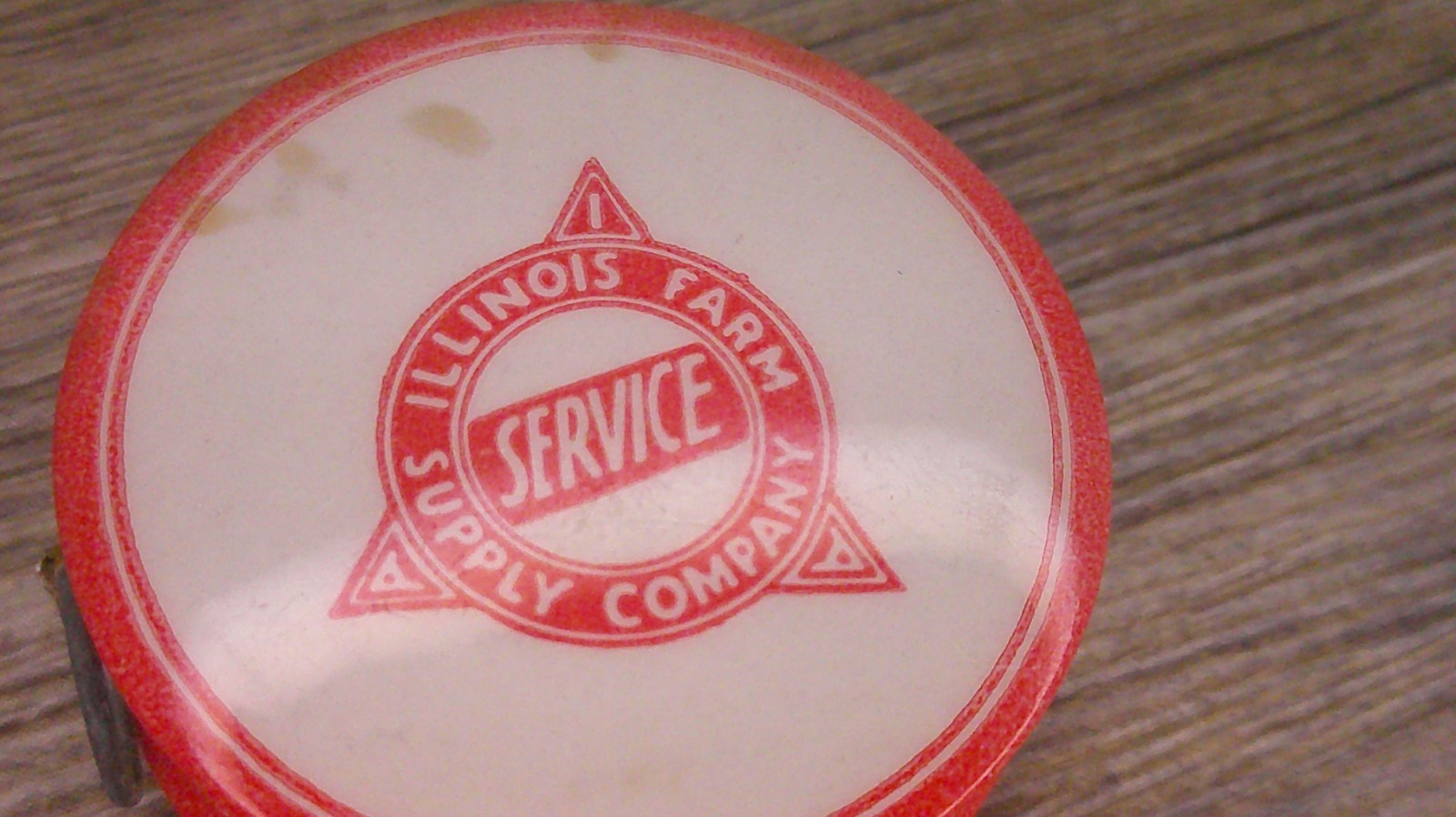 Illinois Farm supply co advertising celluloid tape measure has cloth tape works