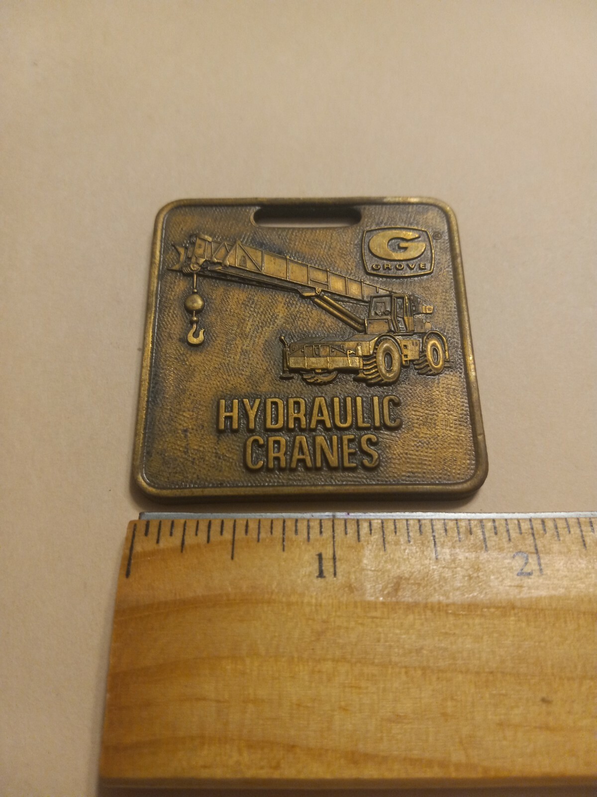 VINTAGE GROVE HYDRAULIC CRANES WATCH FOB ADVERTISING