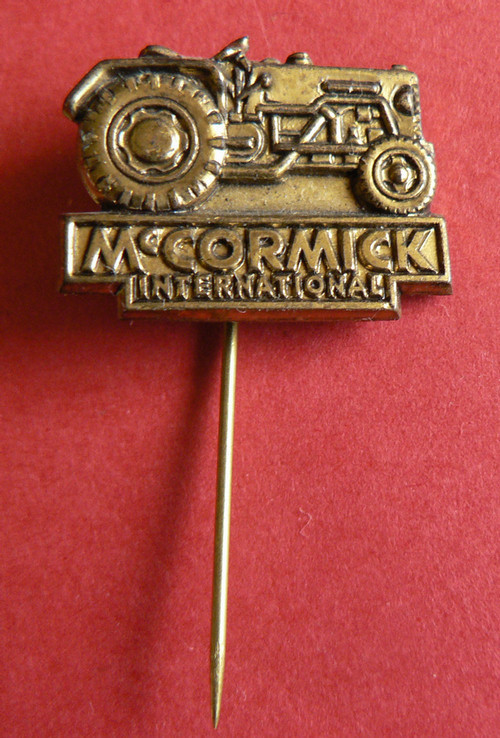 lapel pin MC CORMICK TRACTOR 35 years old {23}