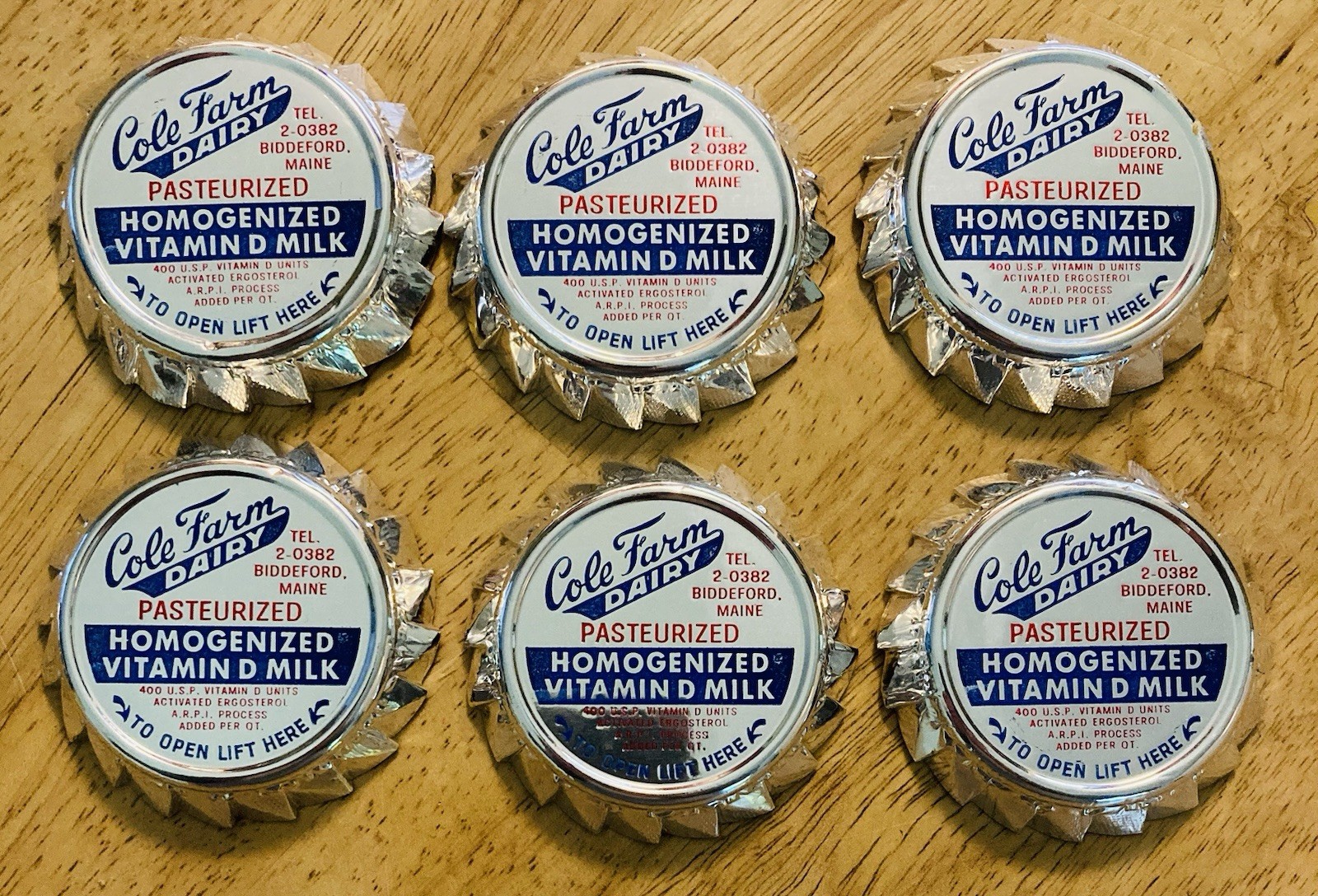 MILK BOTTLE CAP~(6)~COLE DAIRY FARM, BIDDEFORD, MAINE. FOIL MILK CAPS.