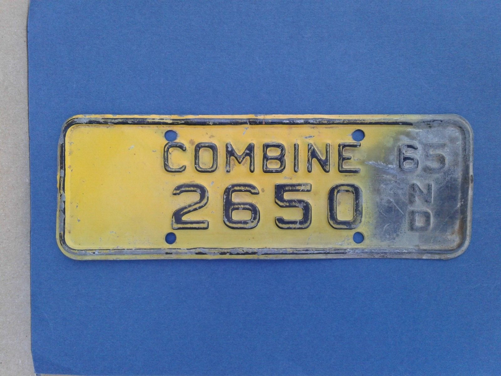 Collectible agriculture N.D. Combine 1965 tag.