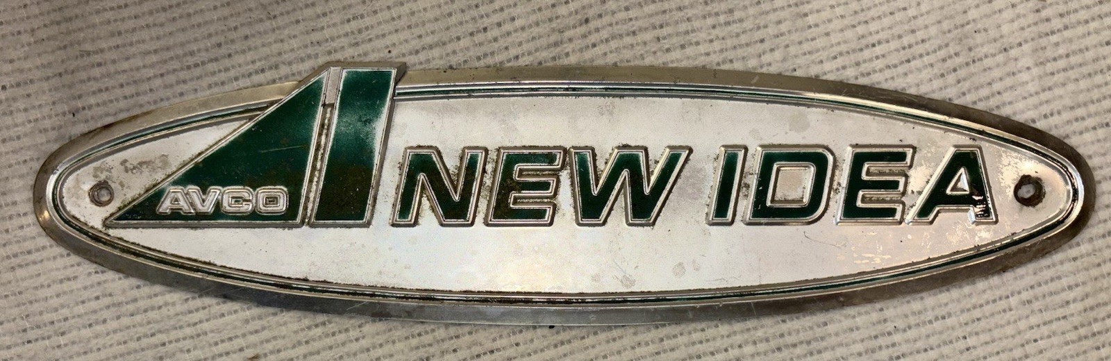 Vintage AVCO “New Idea” Sign/ Emblem 18&Prime; × 4 1/2&Prime; Fair Condition