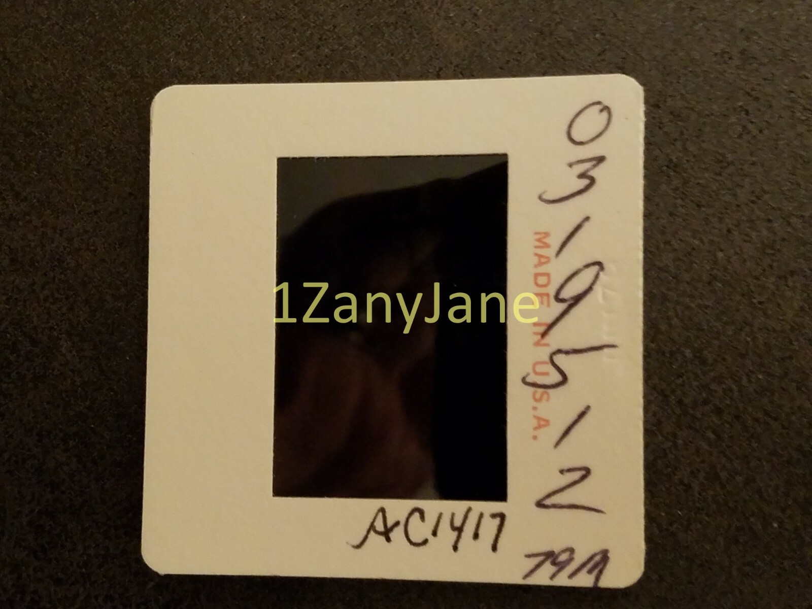 AC1417 35mm Slide of an Allis-Chalmers from MEDIA ARCHIVES MAN MILKING COW