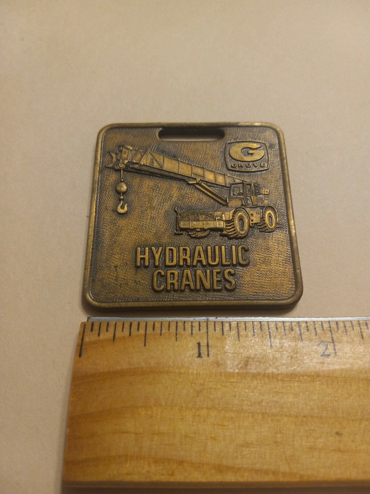 VINTAGE GROVE HYDRAULIC CRANES WATCH FOB ADVERTISING