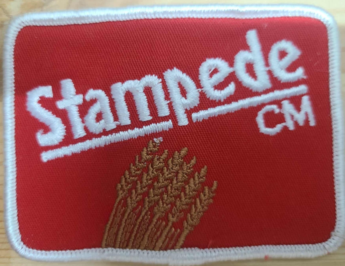 « Stampede CM Embroidered Sew-On Patch Red and White »
