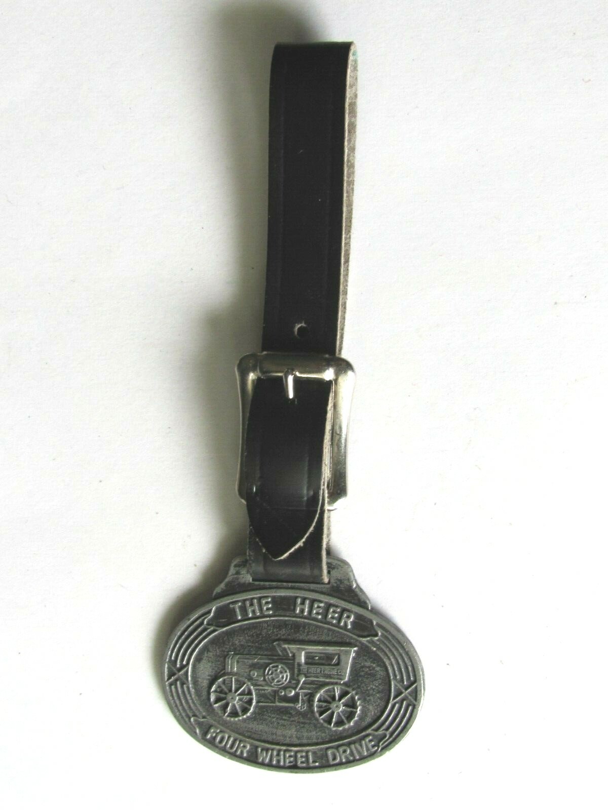 OLD WATCH FOB THE HEER FOUR WHEEL DRIVE TRACTOR HEER ENGINE CO PORTSMOUTH OHIO
