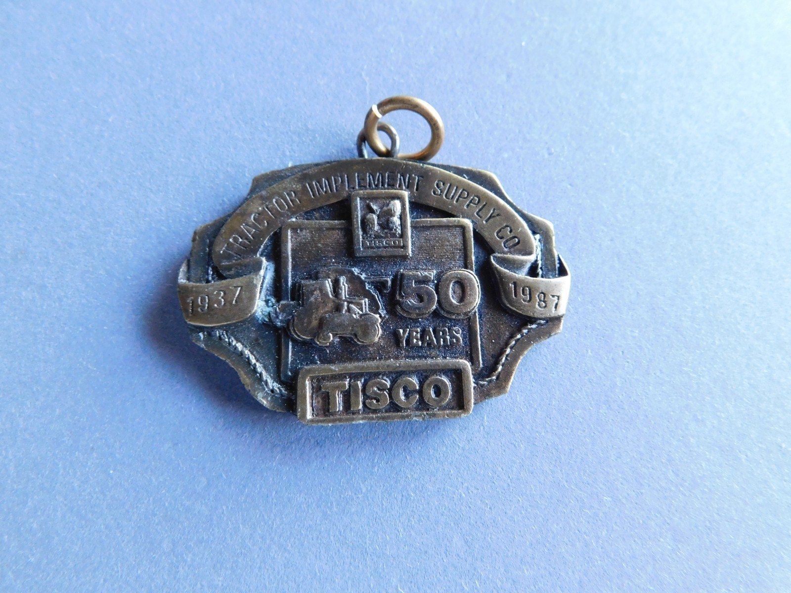 Pendant / Medallion – TISCO : 1987 50 Years : Tractor Implement Supply
