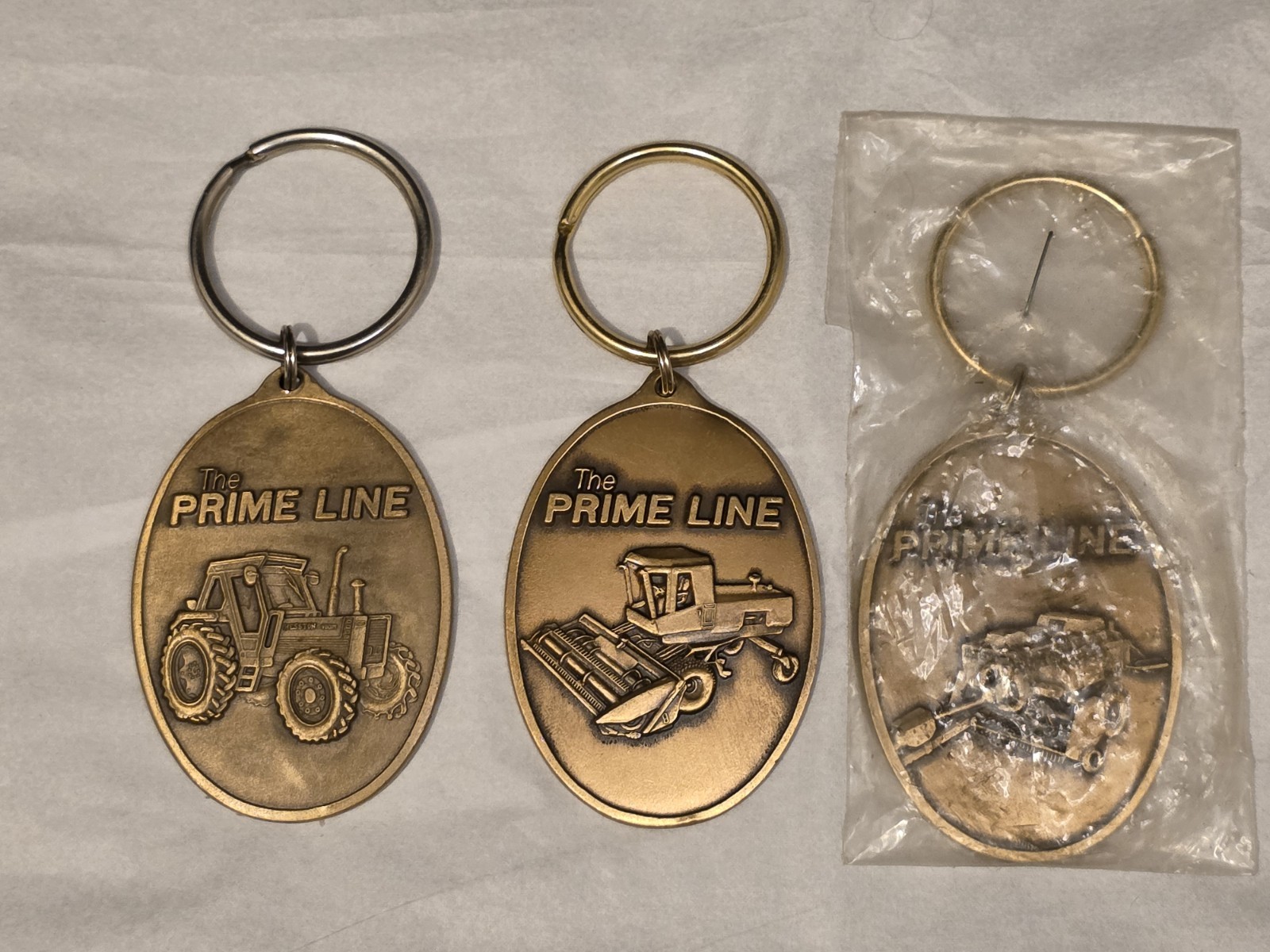 Hesston Prime Line 1984 1985 and 1986 Limited Edition Tractor Keychains