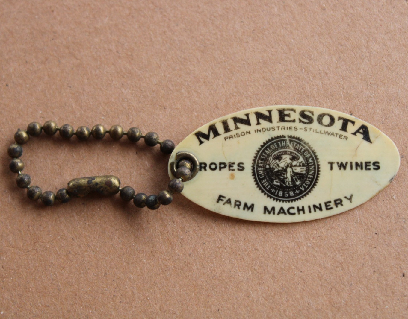 early 1900s era MINNESOTA ROPE TWINE & FARM MACHINERY Old Celluloid Keychain Fob
