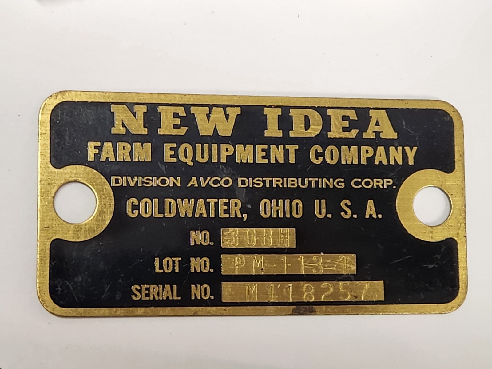 New Idea Farm Equipment Company Metal Brass Tag Emblem Coldwater Ohio