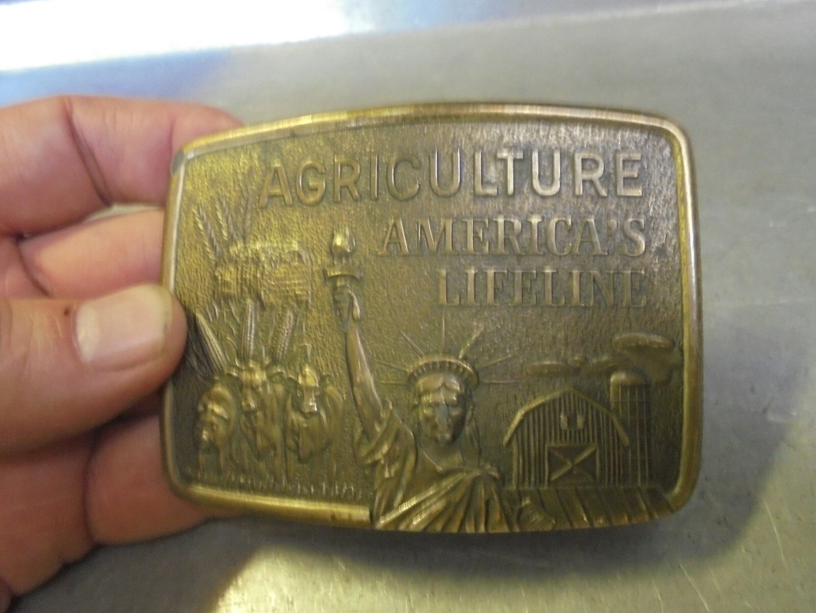 Vintage Farmhand Agriculture America&rsquo;s Lifeline brass belt buckle