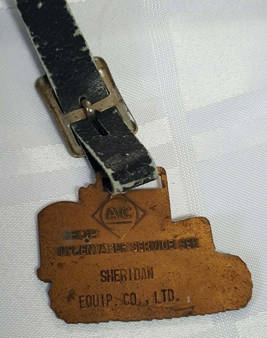AC SHERIDAN EQUIPMENT FOB BADGE ON LEATHER STRAP AGRACULTURE FARM TRACTOR METAL