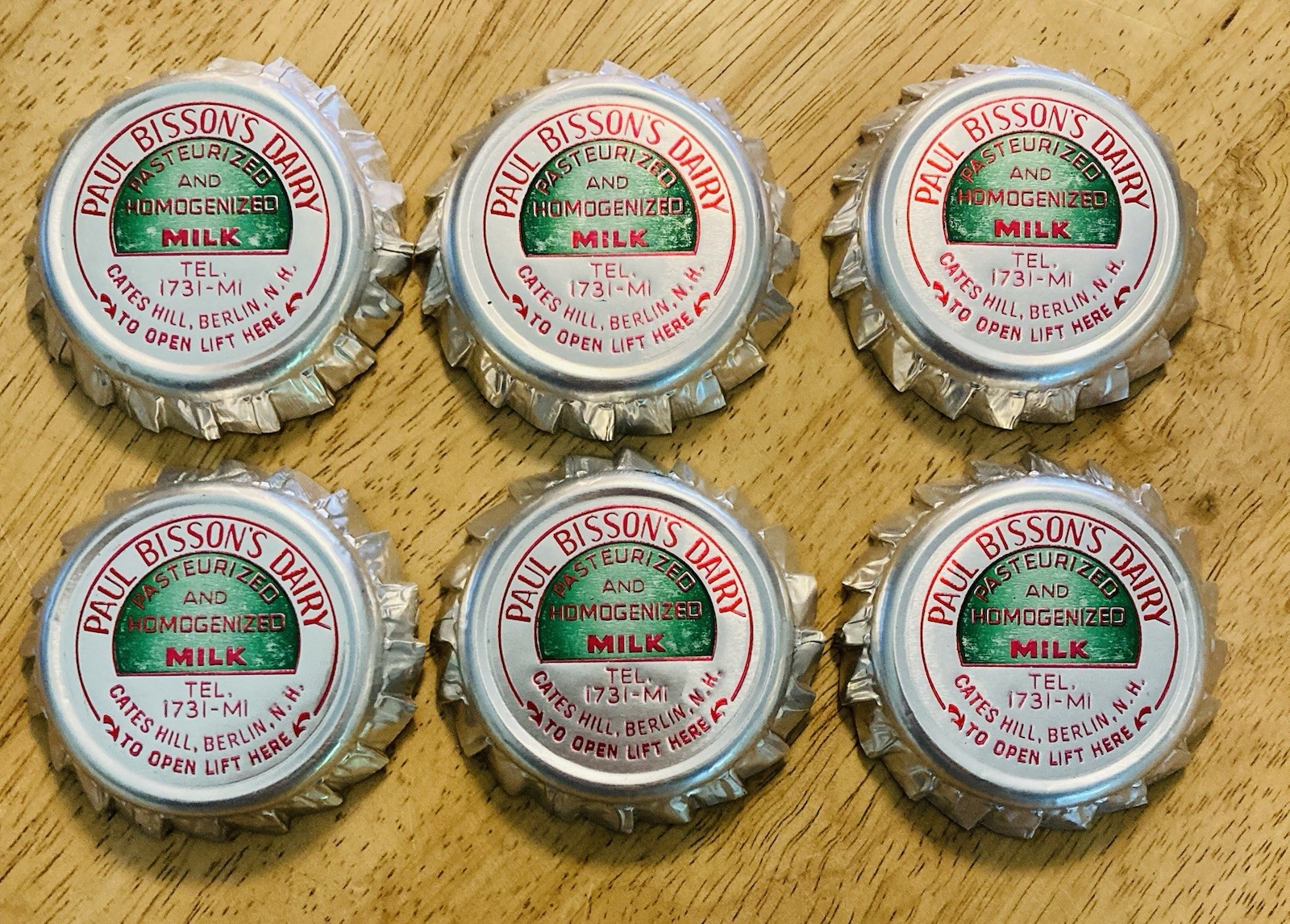 MILK BOTTLE CAP~(6)~PAUL BISSON’S DAIRY, CATES HILL, BERLIN, NH. FOIL MILK CAPS.