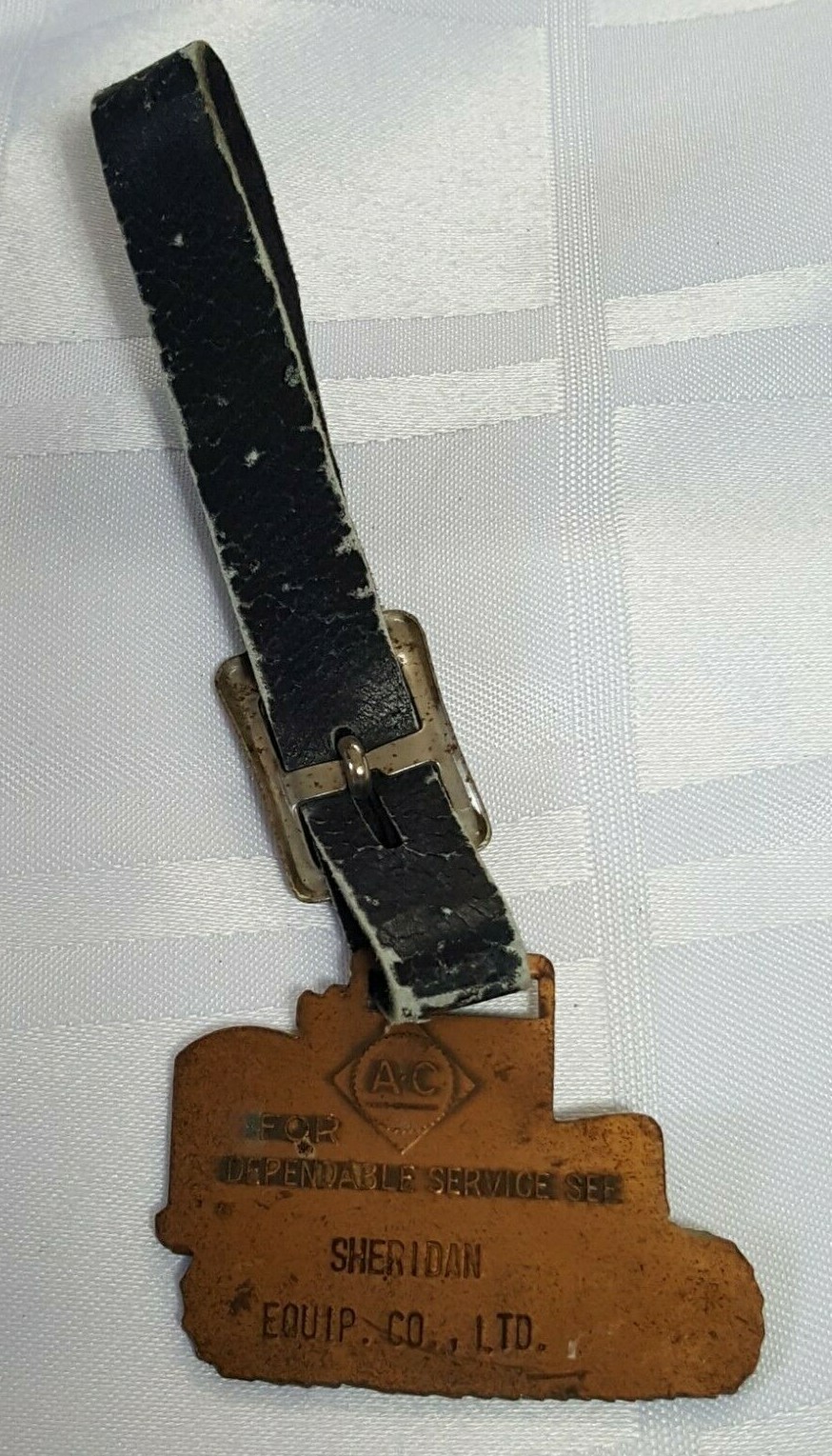 AC SHERIDAN EQUIPMENT FOB BADGE ON LEATHER STRAP AGRACULTURE FARM TRACTOR METAL