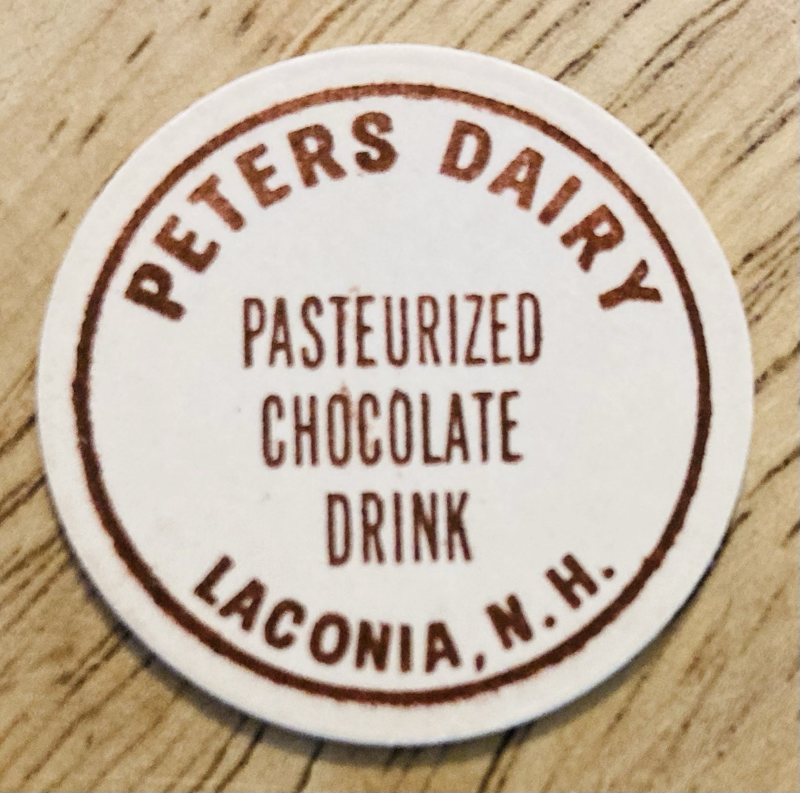 MILK BOTTLE CAP~PETERS DAIRY, LACONIA, NH. CHOCOLATE MILK