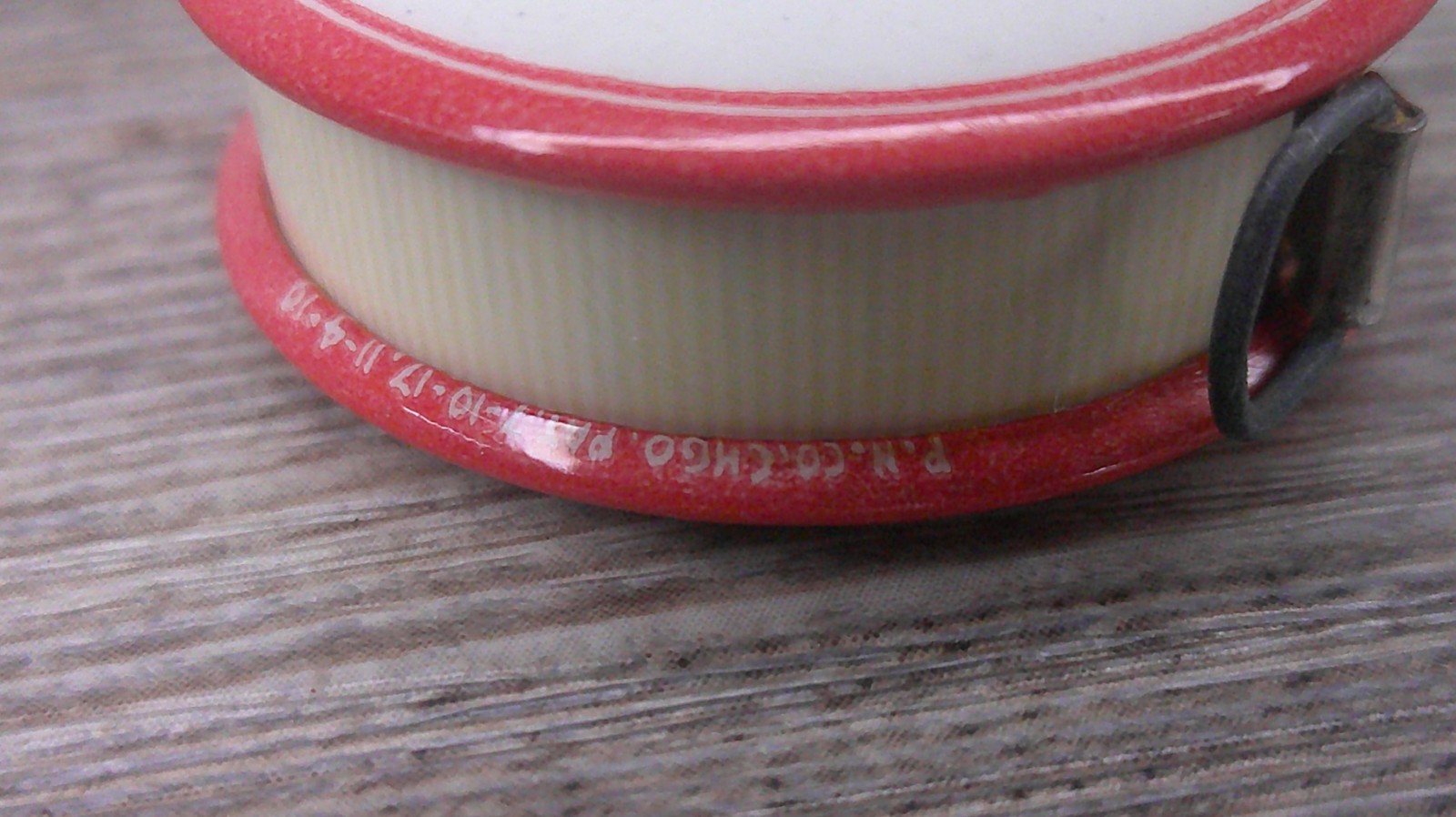 Illinois Farm supply co advertising celluloid tape measure has cloth tape works