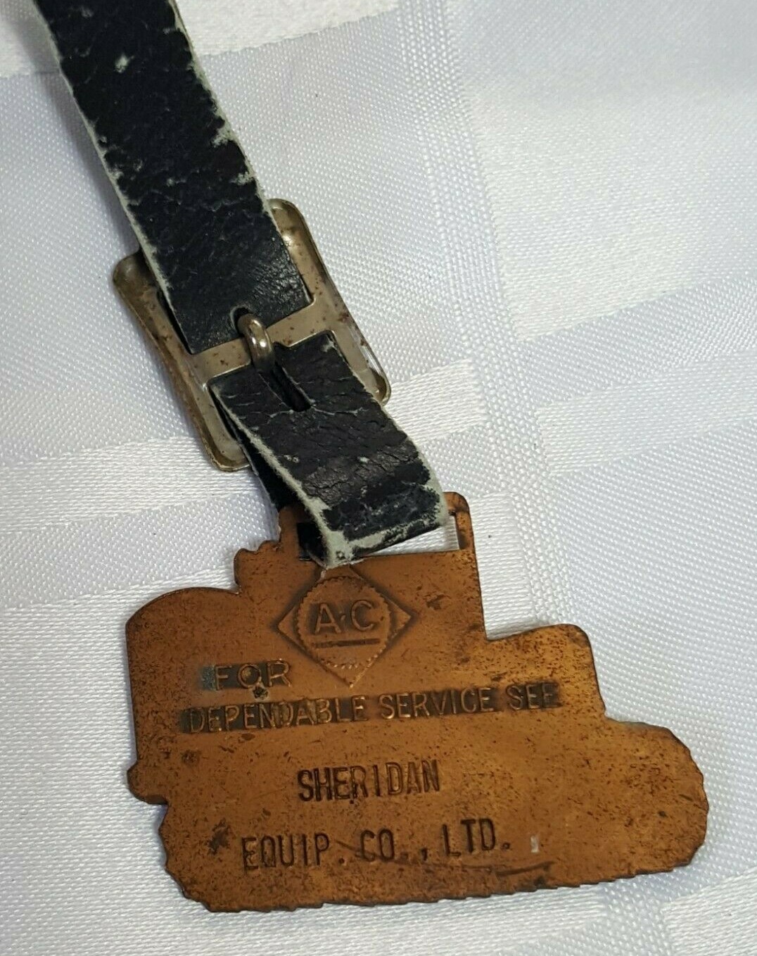 AC SHERIDAN EQUIPMENT FOB BADGE ON LEATHER STRAP AGRACULTURE FARM TRACTOR METAL