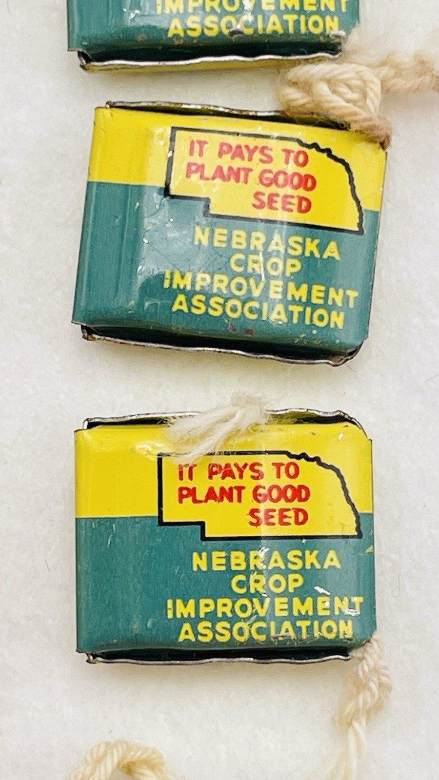Lot 13 VTG Farm Metal Seed Bag Tag Clip NEBRASKA Crop Improvement Assoc & Idaho