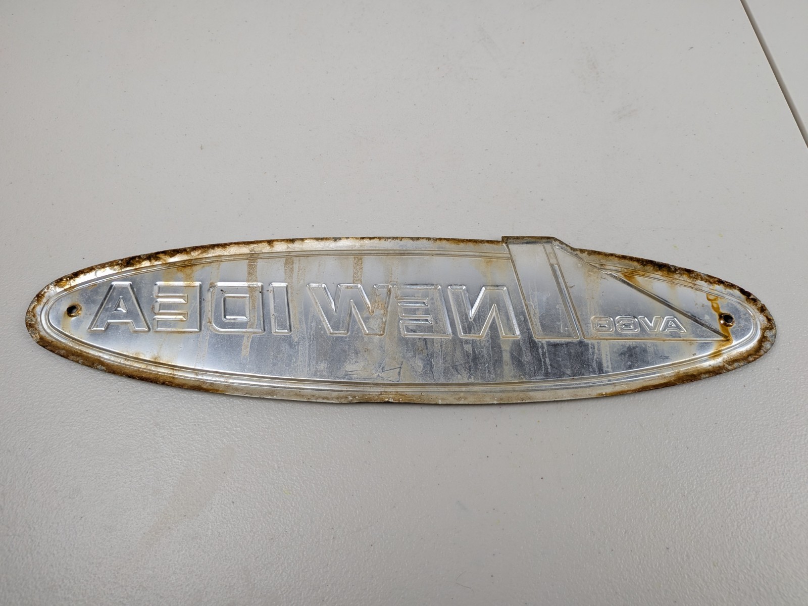Vintage AVCO “New Idea” Sign/ Emblem 18&Prime; × 4 1/2&Prime; Fair Condition