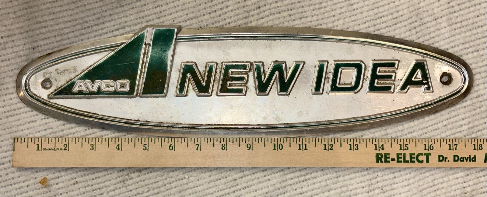 Vintage AVCO “New Idea” Sign/ Emblem 18&Prime; × 4 1/2&Prime; Fair Condition