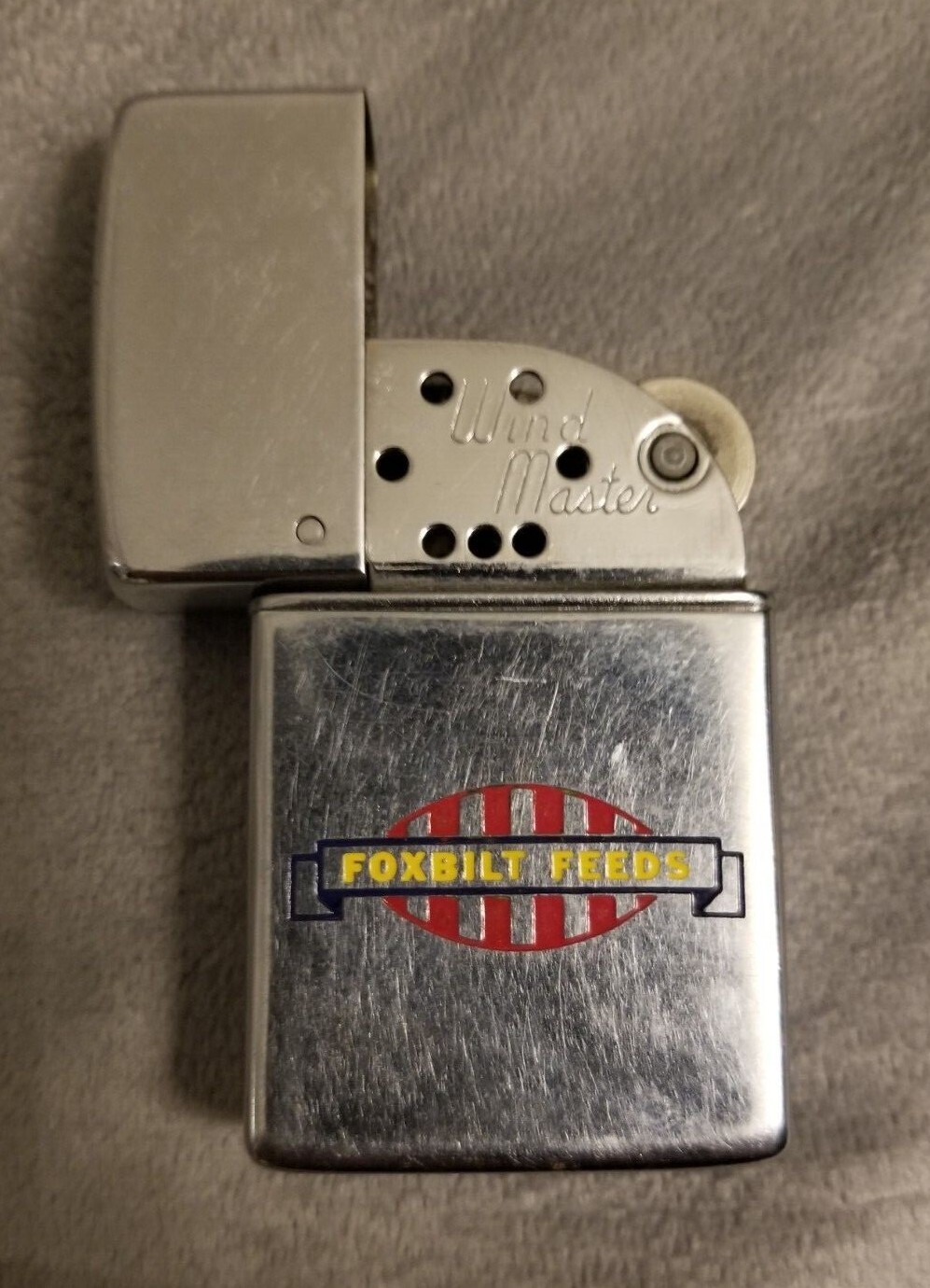 FOXBILT FEEDS, IOWA Vintage – Wind Master Petrol Lighter Advertising