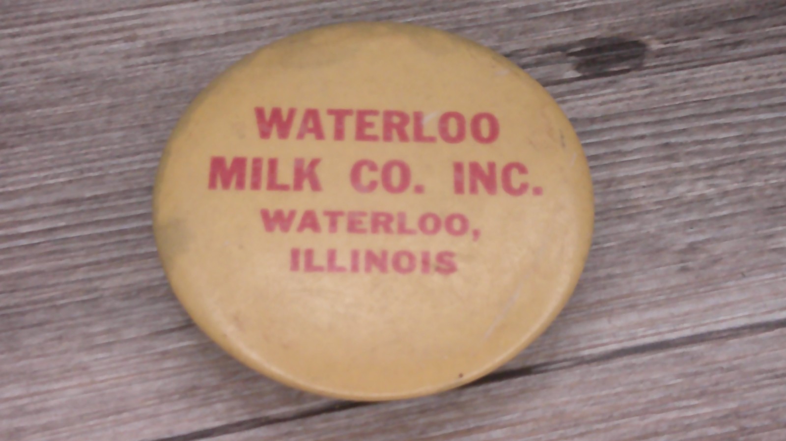 Waterloo milk co. Waterloo, Il. advertising sharpening stone large button shape