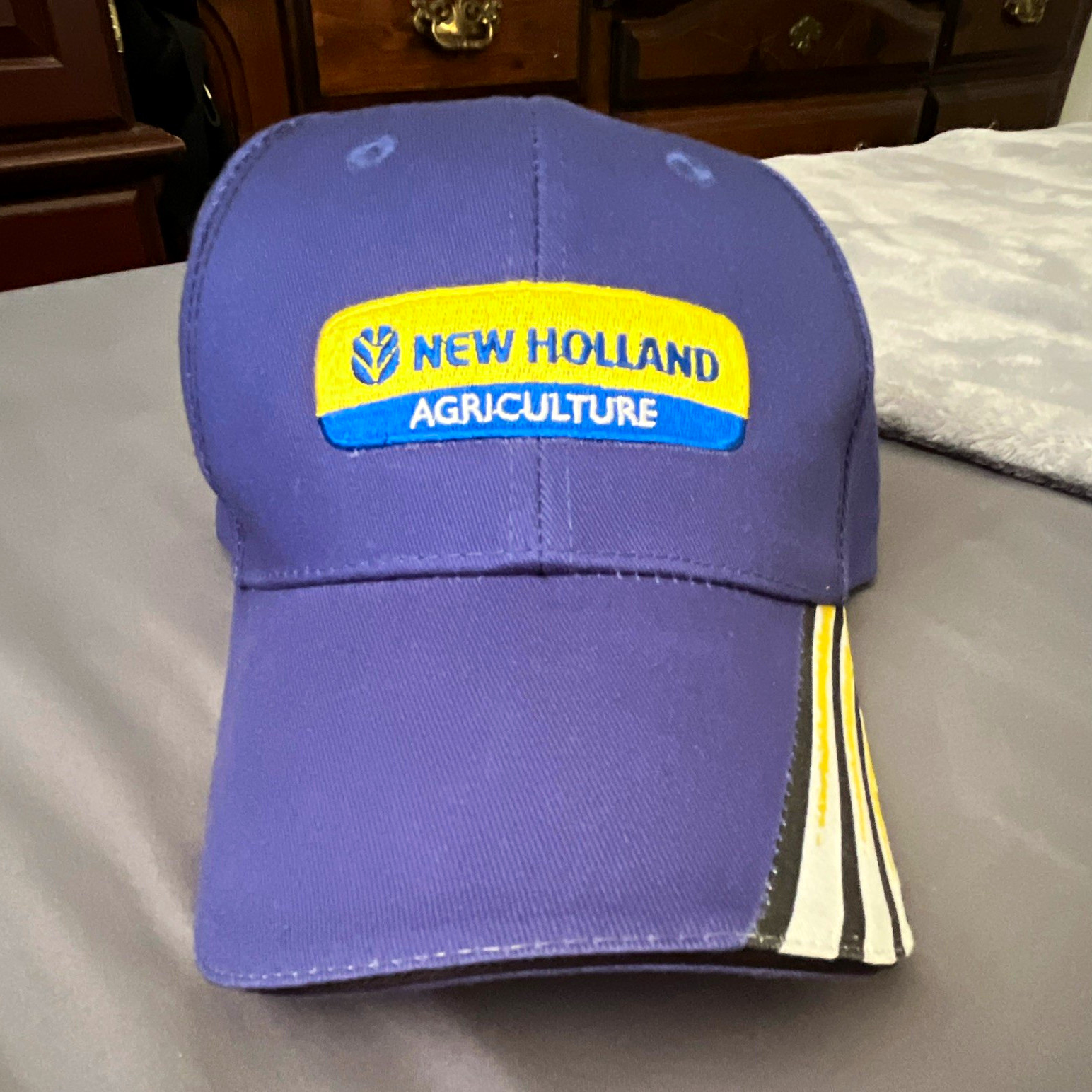 New Holland Agriculture Blue Cap Hat with Yellow Logo, White Accents