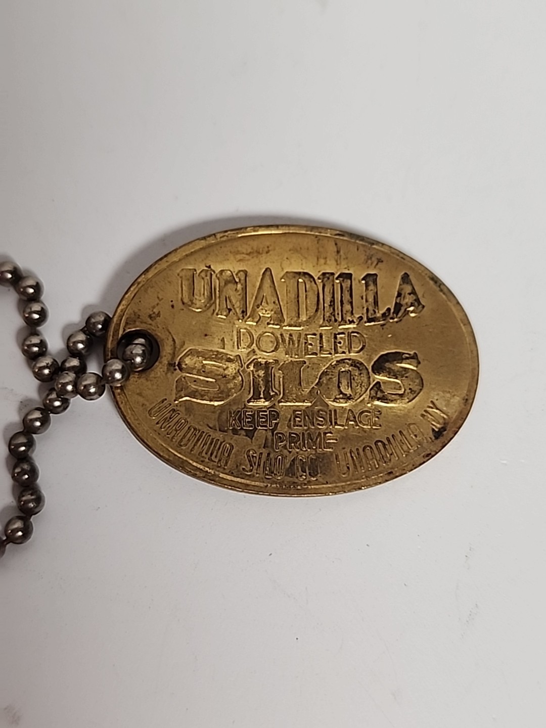 1906 ANTIQUE UNADILLA SILOS NY FARM ADVERTISING PENDANT KEYCHAIN CHARM FOB TAG