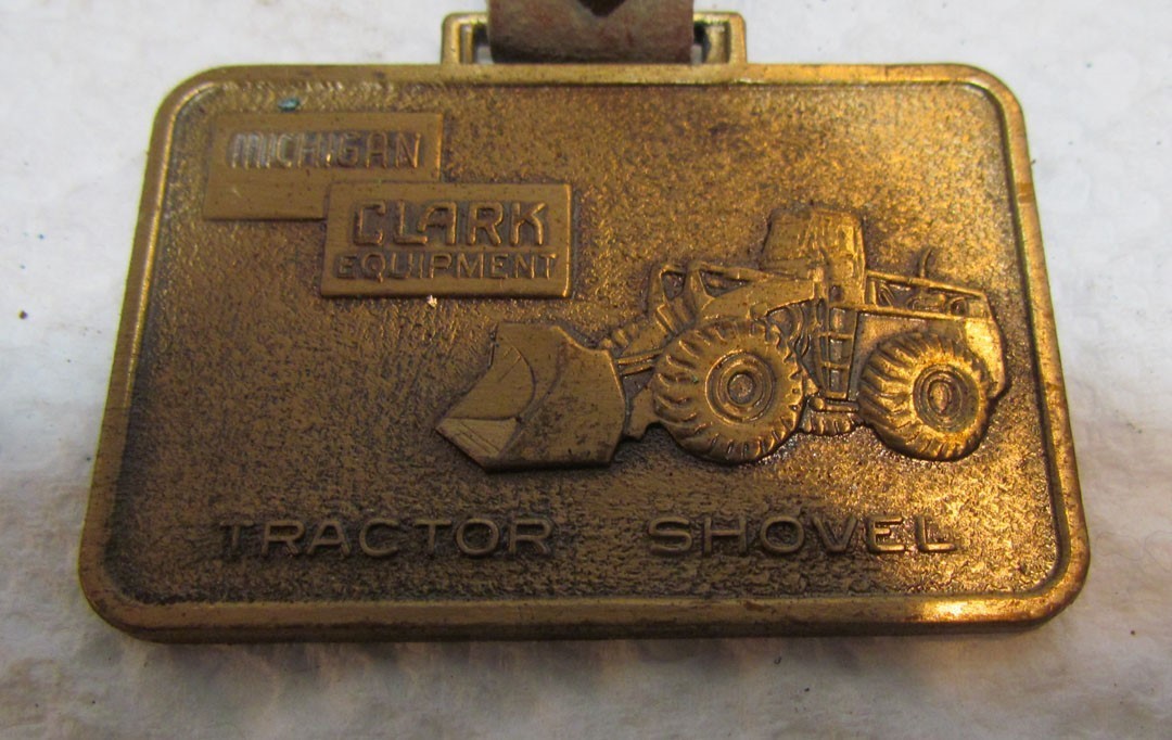 CLARK EQUIPMENT MICHIGAN TRACTOR SHOVEL METAL WATCH FOB VINTAGE ADVERTISING