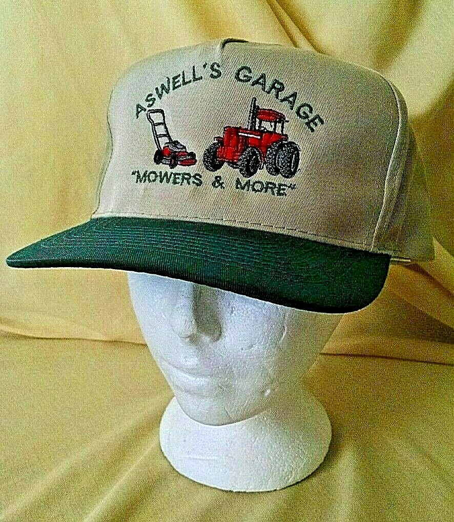 ASWELL&rsquo;S GARAGE HAT MOWERS & MORE GRASS CUTTER TRACTOR BEIGE GREEN OTTO ADJBL.