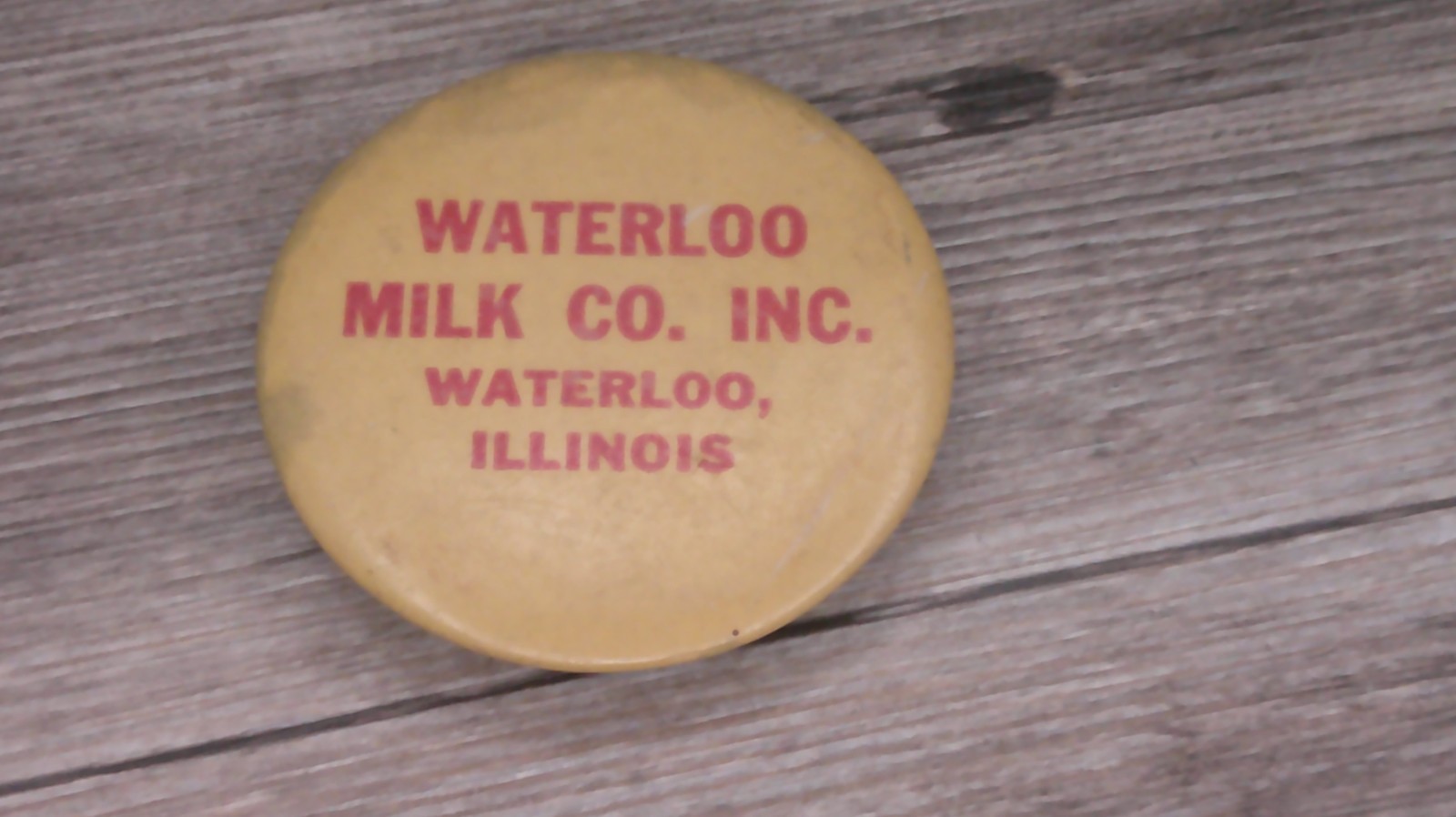 Waterloo milk co. Waterloo, Il. advertising sharpening stone large button shape