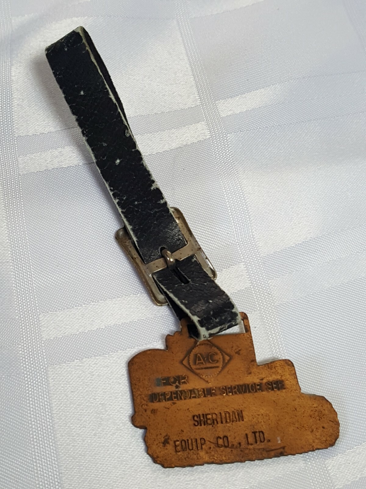 AC SHERIDAN EQUIPMENT FOB BADGE ON LEATHER STRAP AGRACULTURE FARM TRACTOR METAL